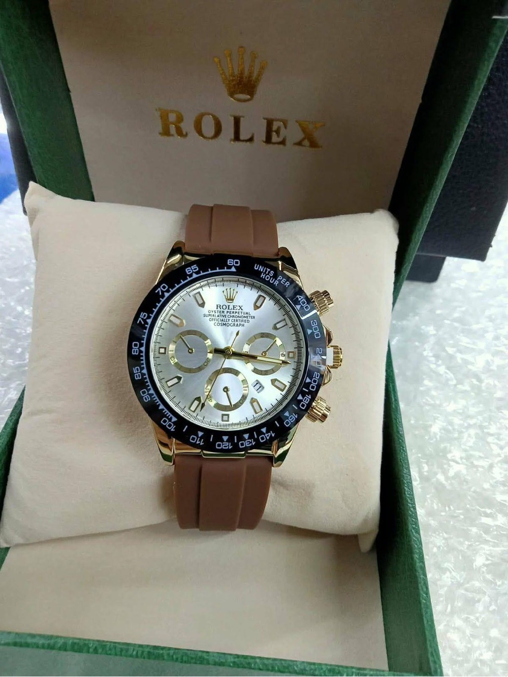 Rolex Gold-Tone Chronograph Watch with Brown Strap and Black Bezel